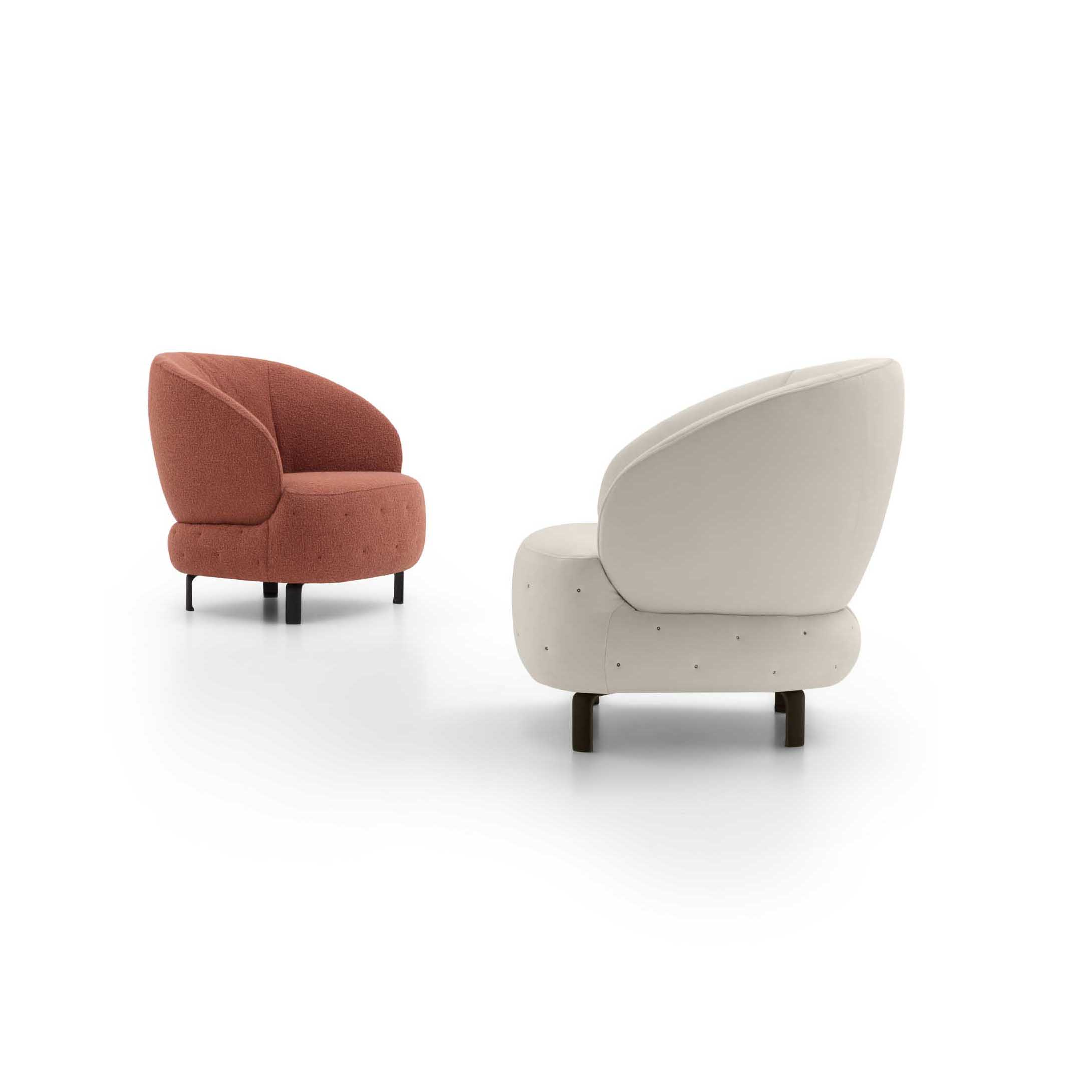 Rounded armchair in two versions: white and copper with quilted upholstery