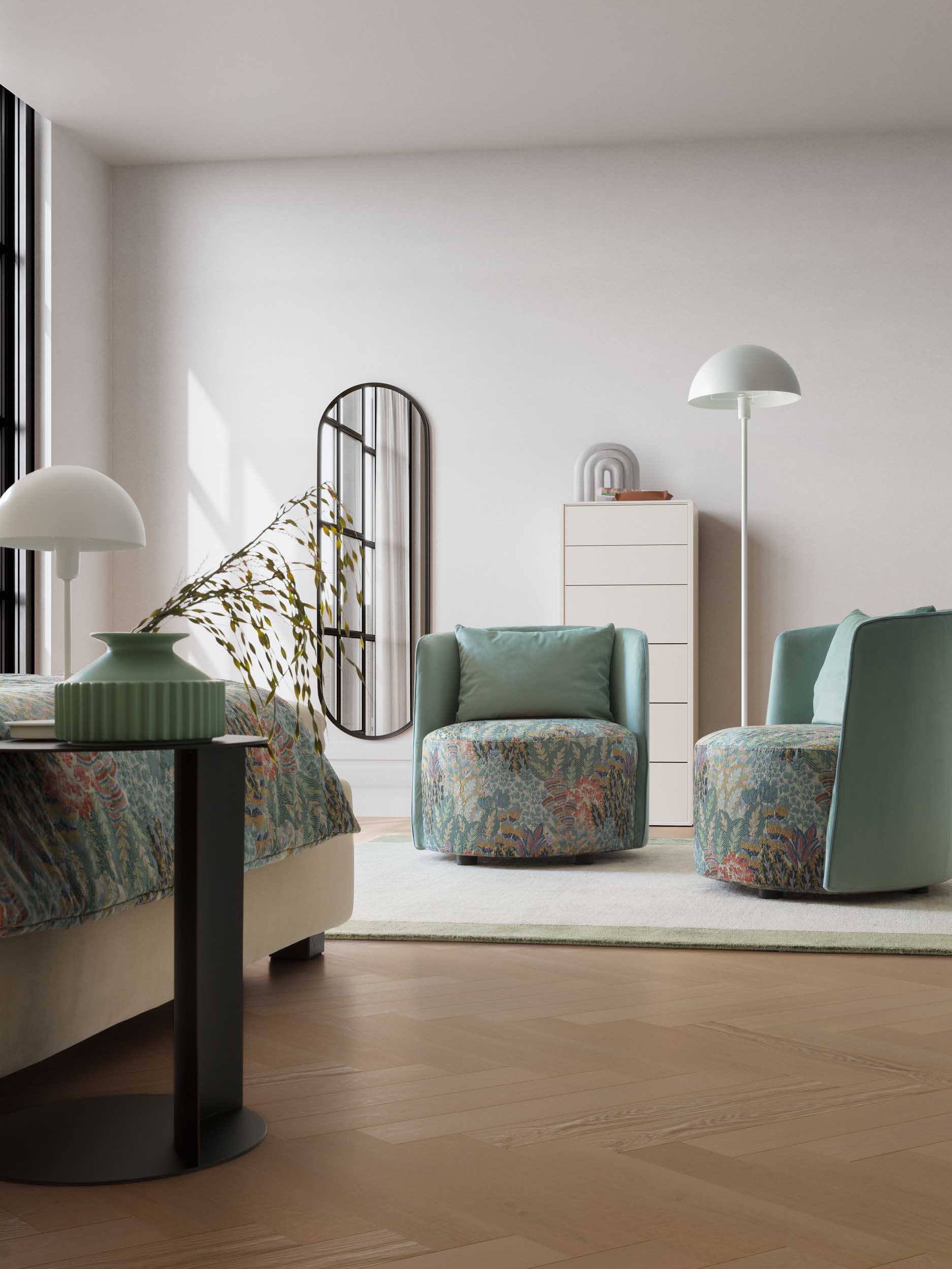 Reading nook in a modern bedroom with floral-patterned armchairs and cushions