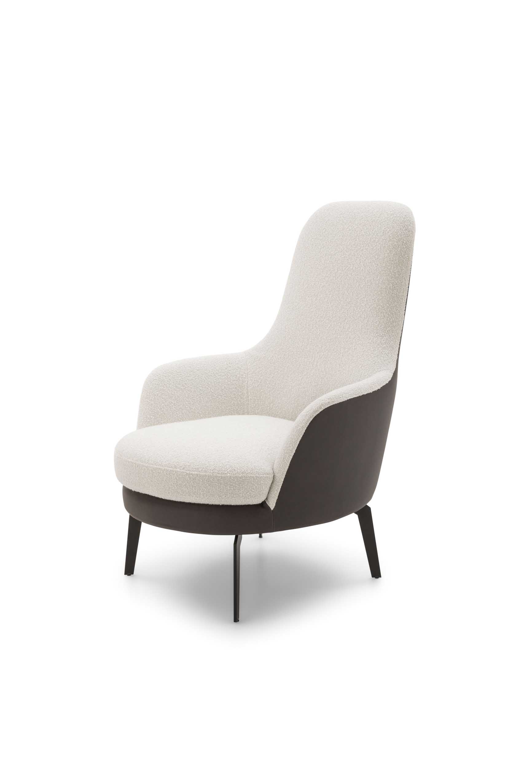 Armchair with high backrest and comfortable armrests. Two-tone upholstery.