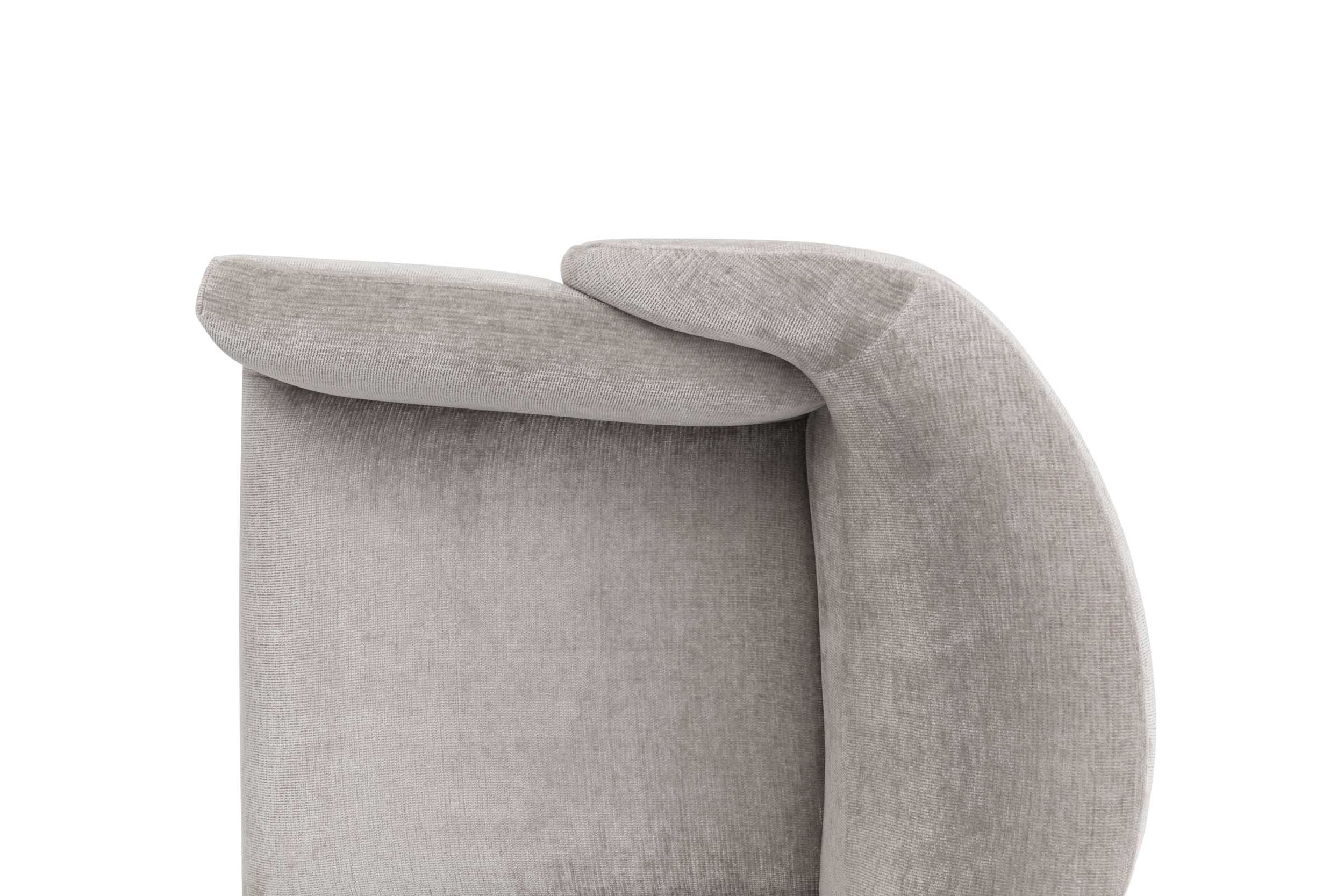 Close-up of the backrest and armrest of a modern armchair.