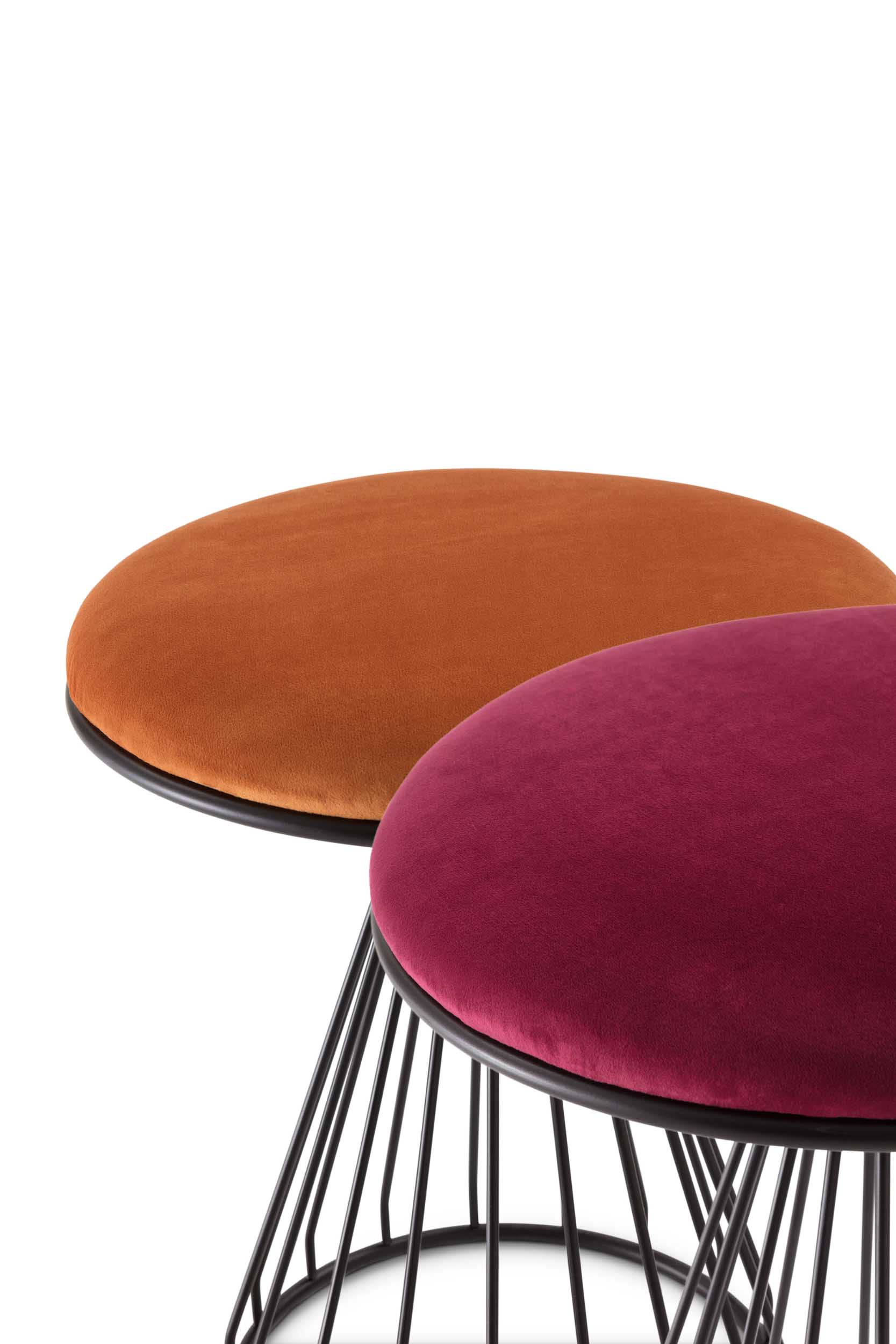 Pouf with a metal frame, upholstered surface, and velvety fabric cover