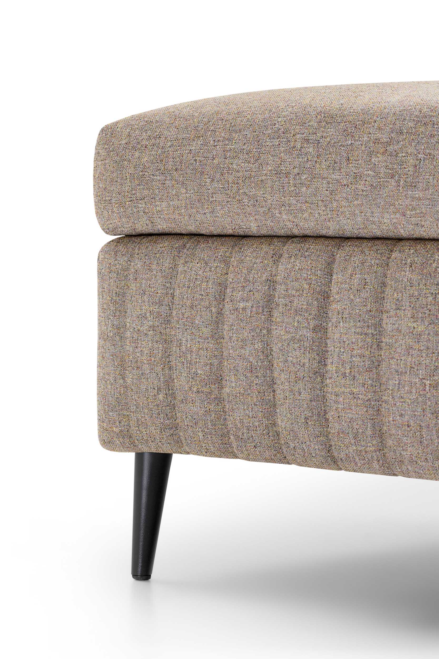 Close-up of the quilted upholstery of the Treasure pouf