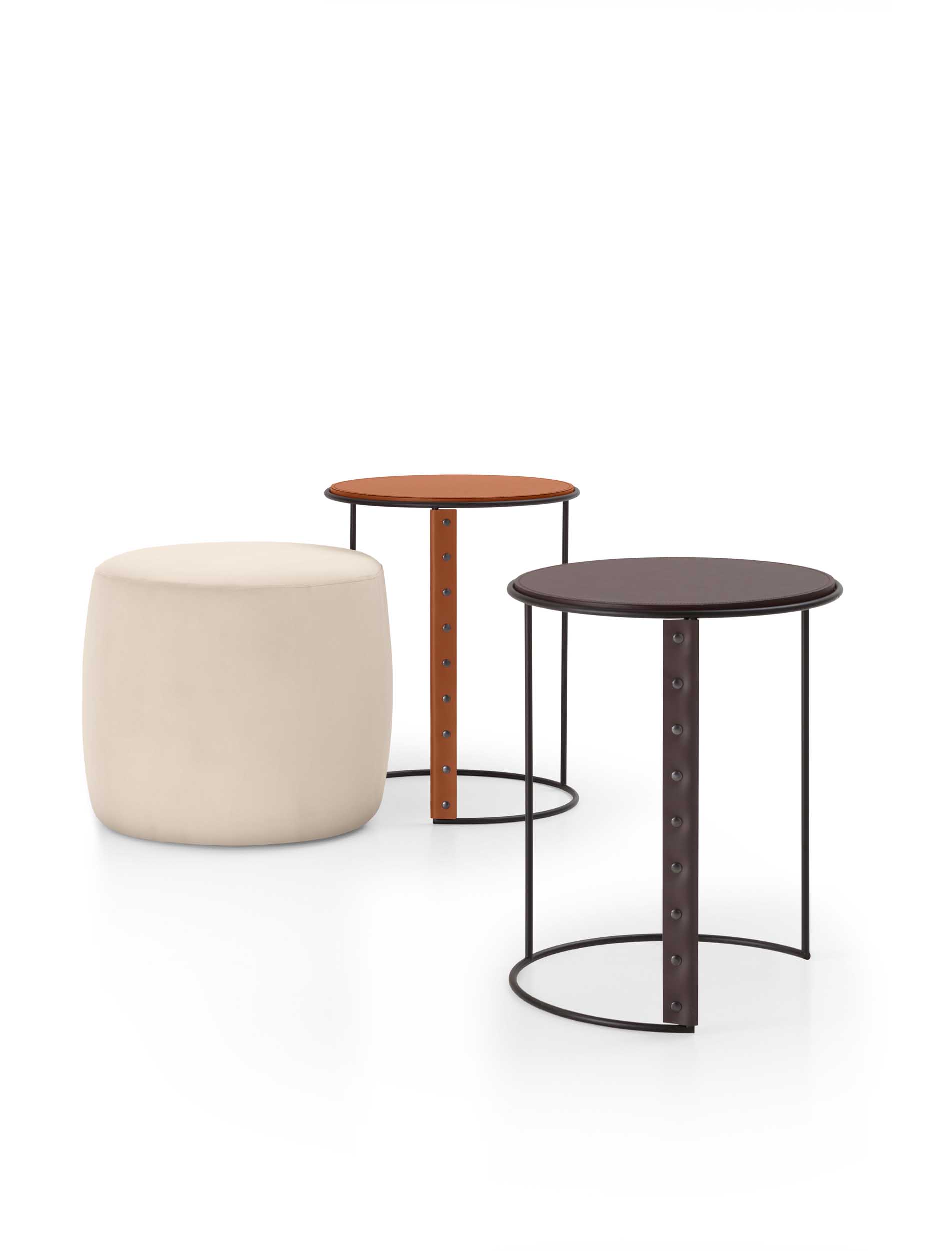 Set of nesting tables and poufs with various leather coverings