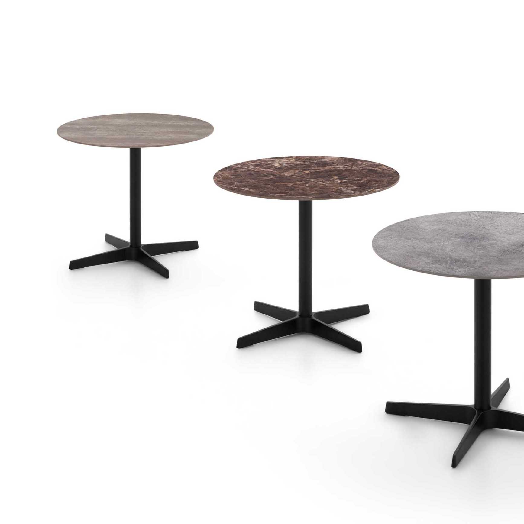 Coffee tables with tops in stoneware, oak, and grey stone with metal frames.