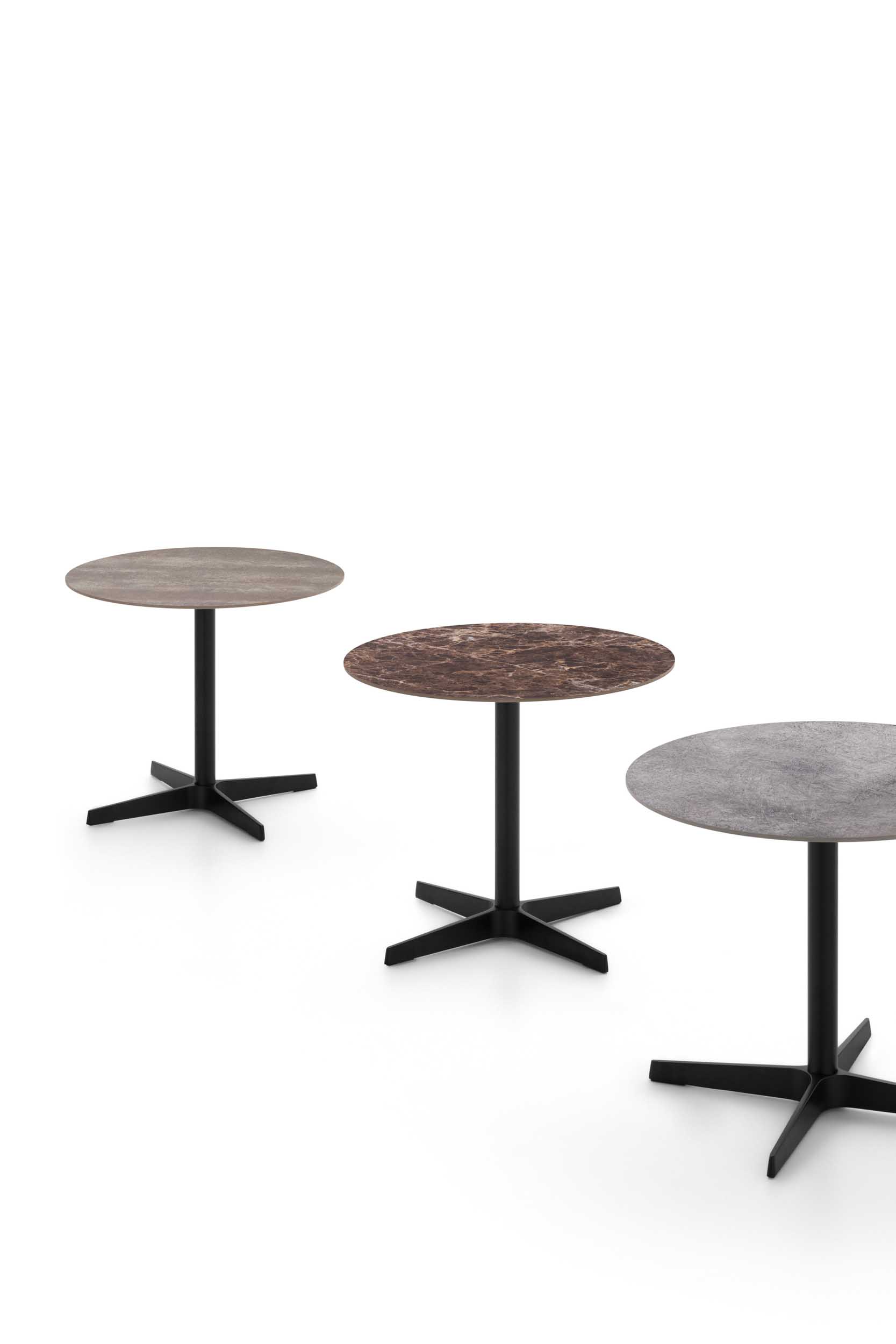 Coffee tables with tops in stoneware, oak, and grey stone with metal frames.