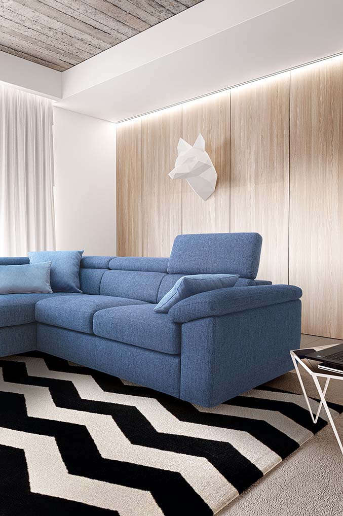 Comfortable blue fabric sofa with headrest fully extended